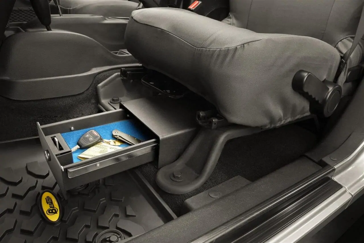 https://www.4wheelparts.com/the-dirt/wp-content/uploads/sites/3/2020/11/03-Bestop-Jeep-Wrangler-JK-Lockable-Under-Seat-Storage-Box-1280x853.jpg.webp
