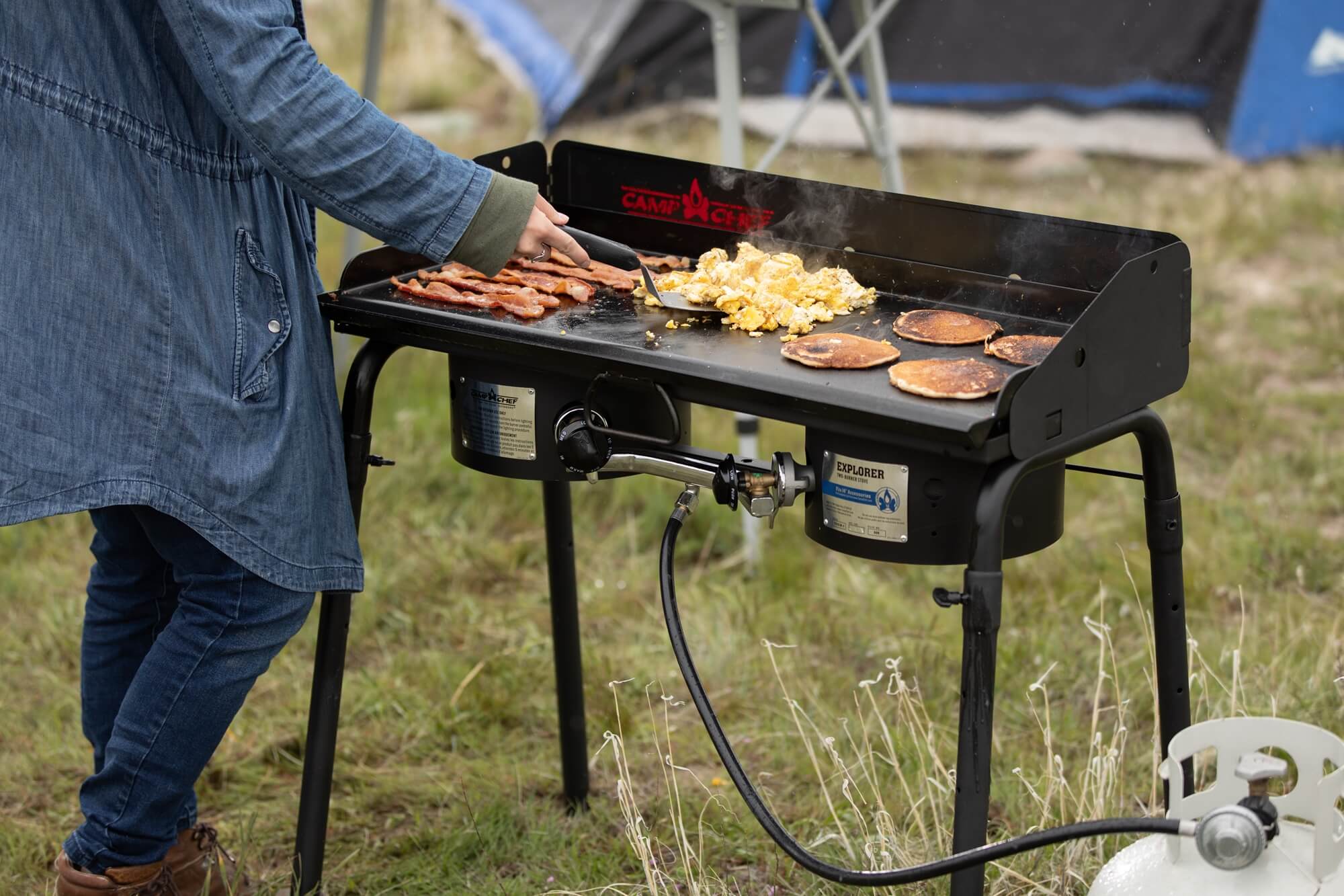 The durable, versatile Camp Chef Explorer Two-Burner cooking system packs enough power in its 30,000 BTU burners to boil water and cook your food in a hurry. Portability is no problem with the removable legs, and a three-sided windscreen makes outdoor cooking easy. Being one of Camp Chef's 14" cooking systems, the Explorer is very versatile and can be equipped with many different Camp Chef accessories, from the Professional Grill Box to the Italia Artisan Pizza Oven.